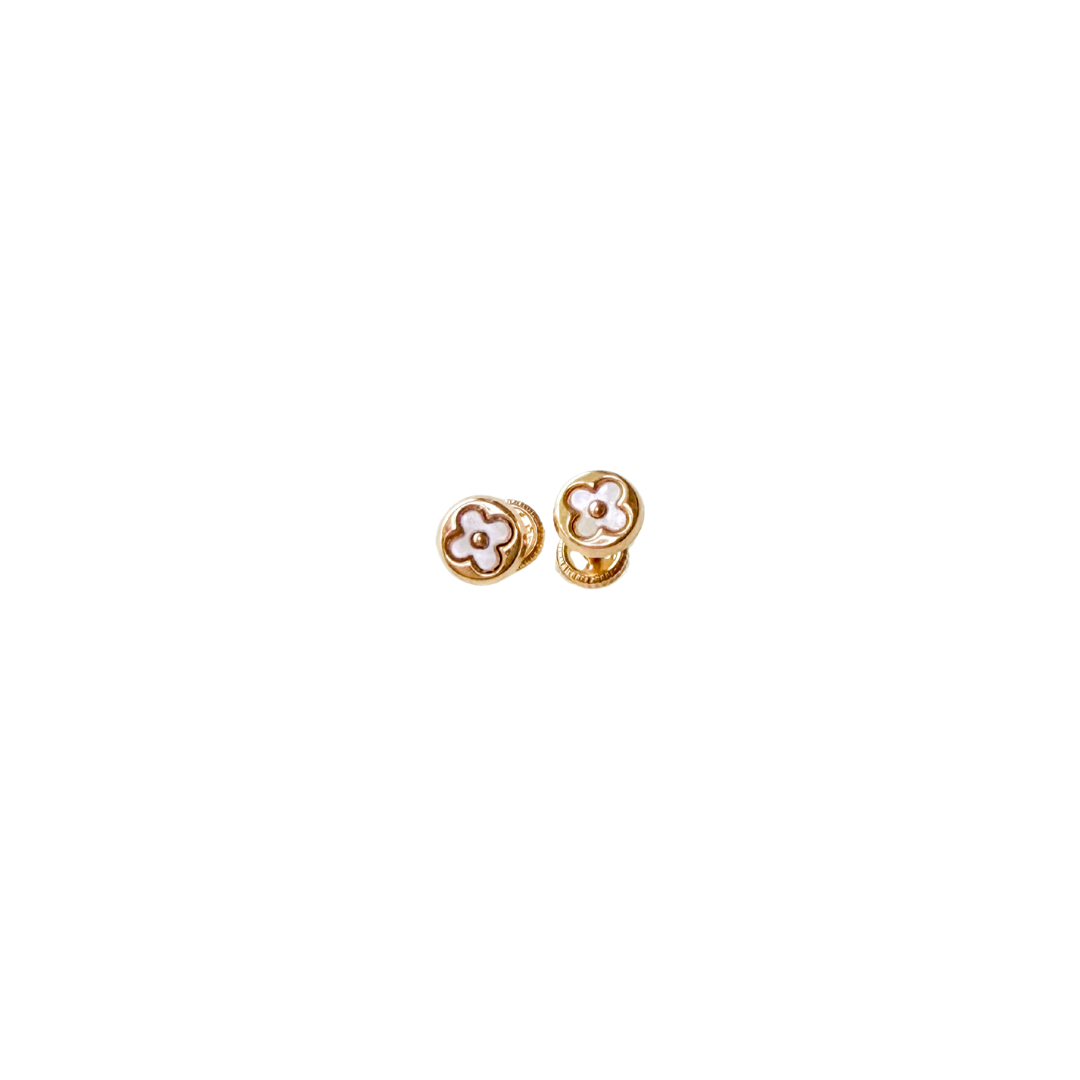 Pair of gold earrings on a white background