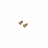Gold star-shaped earrings on a white background
