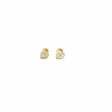 Heart-shaped gold earrings on a white background