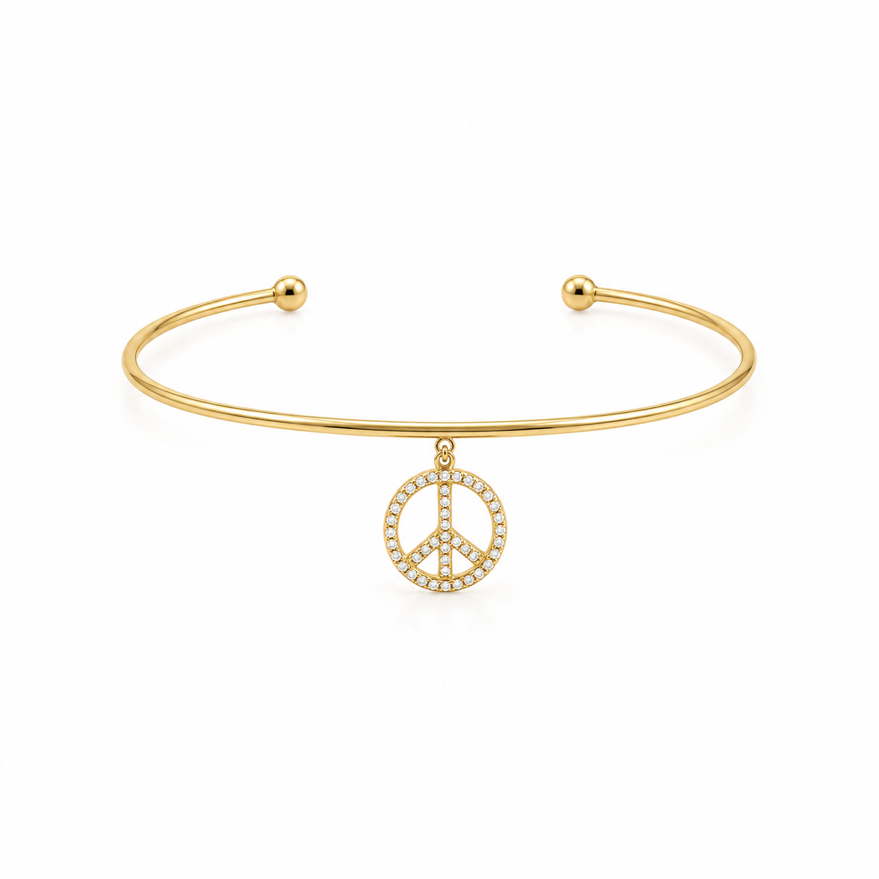 14K solid yellow gold open cuff bangle with dangling pavé diamond peace sign charm and polished ball ends on a white background.