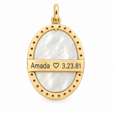 Back view of a 14K solid yellow gold Miraculous Medal featuring a mother-of-pearl inlay and a personalized engraving of your choice. Pendant measures 24.4 x 19.3 mm with a 4 mm bail.