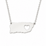 925 sterling silver Puerto Rico map necklace featuring a polished island-shaped plate with a heart cutout and delicate link chain on a pure white background.