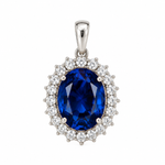Certified 14K solid white gold pendant featuring a 5.62 CT oval lab-grown blue sapphire surrounded by a 0.44 CTW lab-grown diamond halo on a white background.