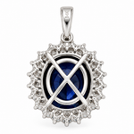 Back view of 14K solid white gold oval blue sapphire and diamond halo pendant with open gallery setting and polished bail on a white background.