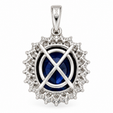 Back view of 14K solid white gold oval blue sapphire and diamond halo pendant with open gallery setting and polished bail on a white background.