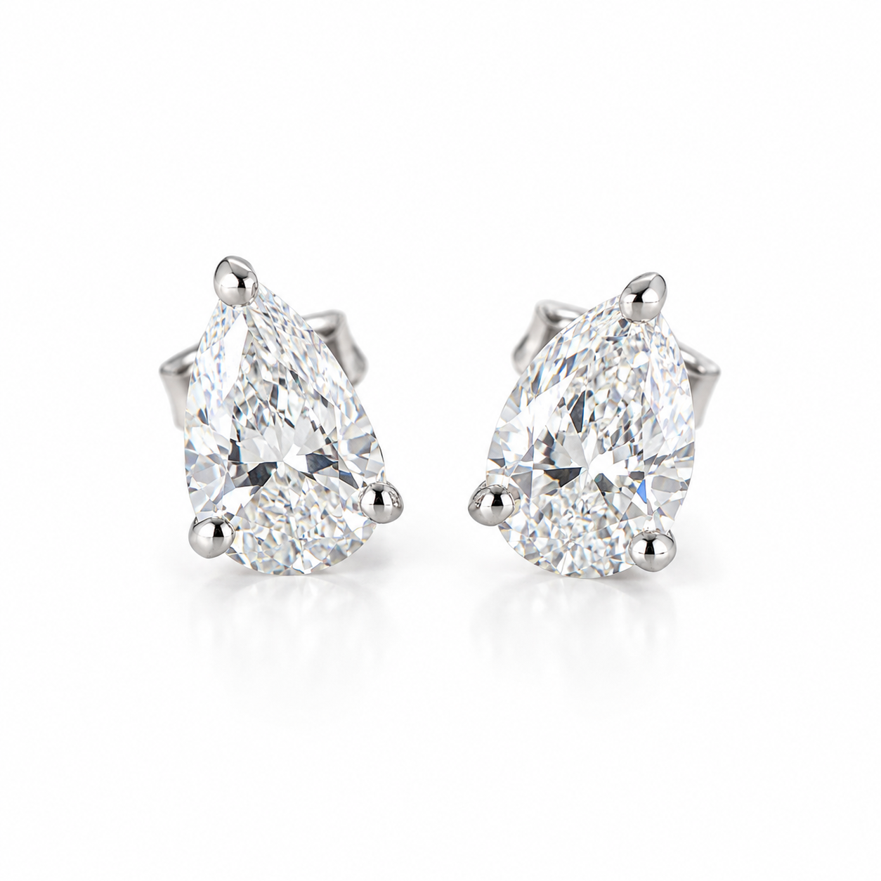 14K solid white gold pear-shaped lab-grown diamond stud earrings featuring approximately 1.10 CTW with push backs on a white background.