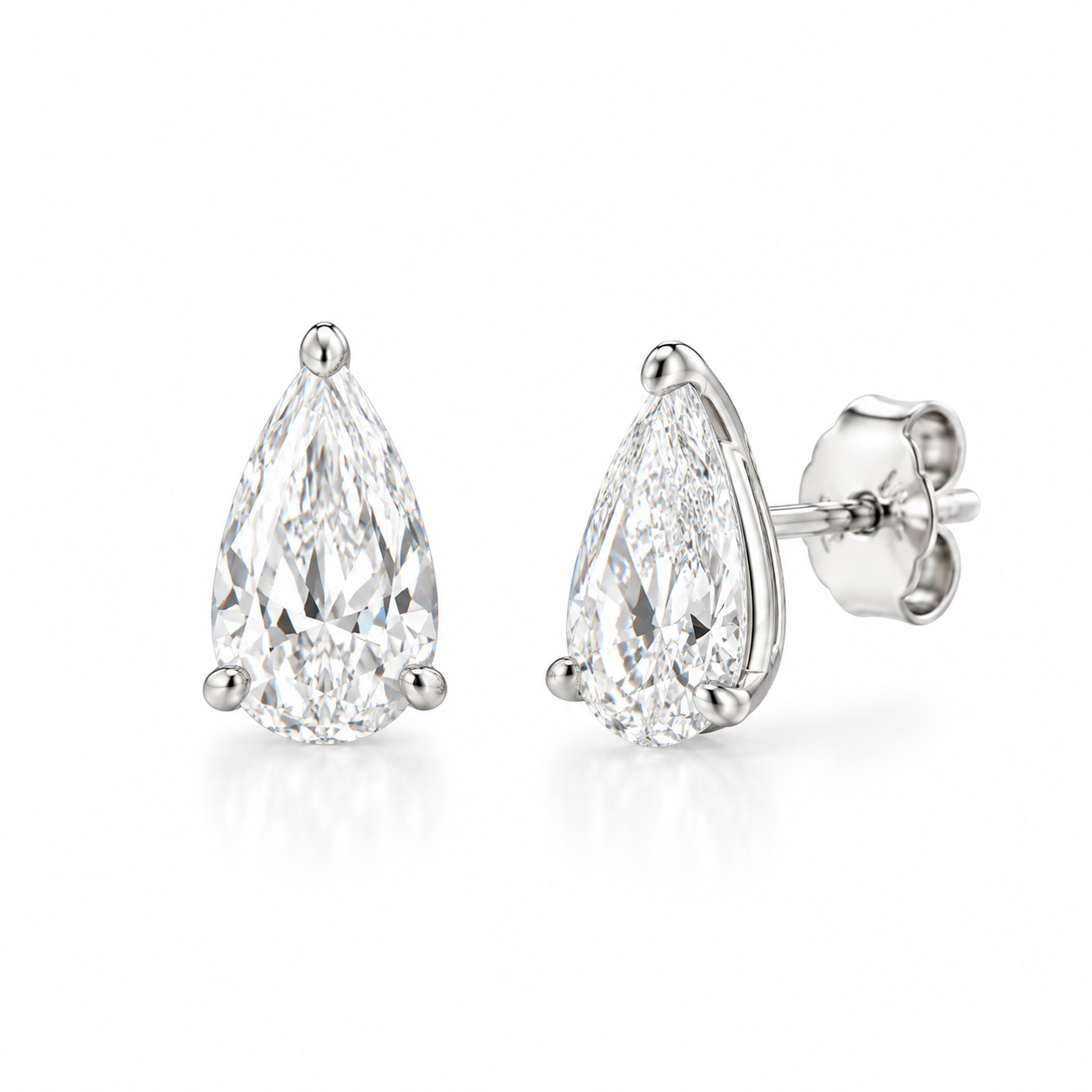 14K solid white gold elongated pear-shaped lab-grown diamond stud earrings featuring 0.54 CTW, E/F color and VS1 clarity on a white background.