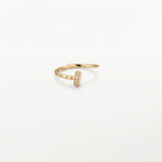 14K solid yellow gold adjustable nail ring with sparkling clear cubic zirconia stones on a white background.