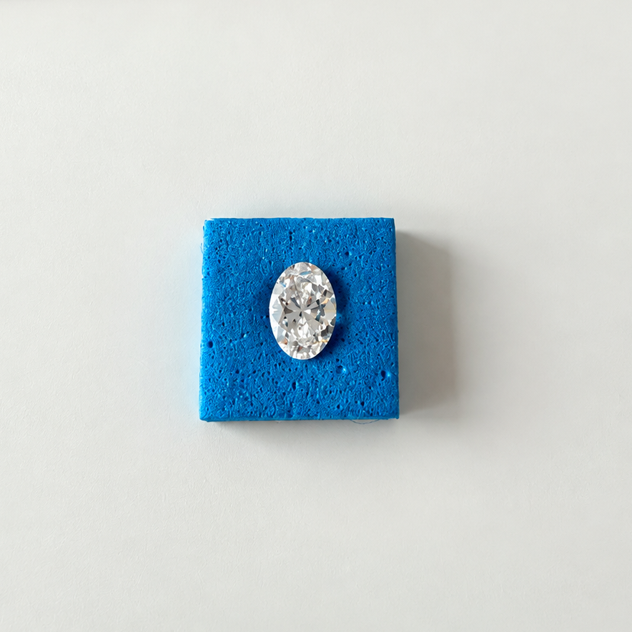 IGI certified 2.09 CT oval brilliant lab-grown diamond with E color and VS1 clarity on a white background.