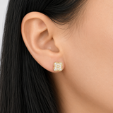 Woman wearing 14K solid yellow gold diamond clover stud earrings featuring a delicate four-leaf clover design with sparkling natural diamonds.