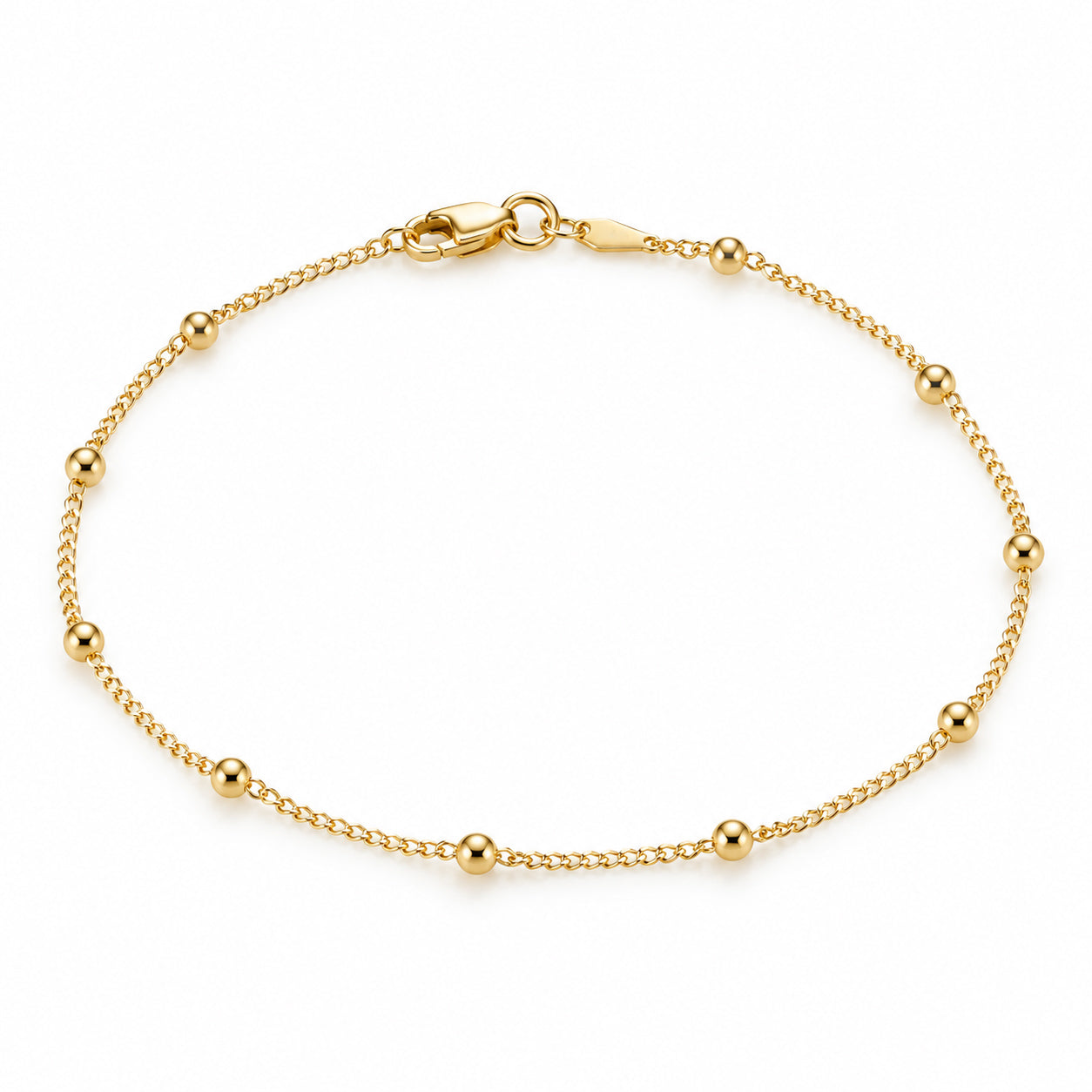 14K solid yellow gold beaded anklet with delicate chain, polished round beads, and lobster clasp on a white background