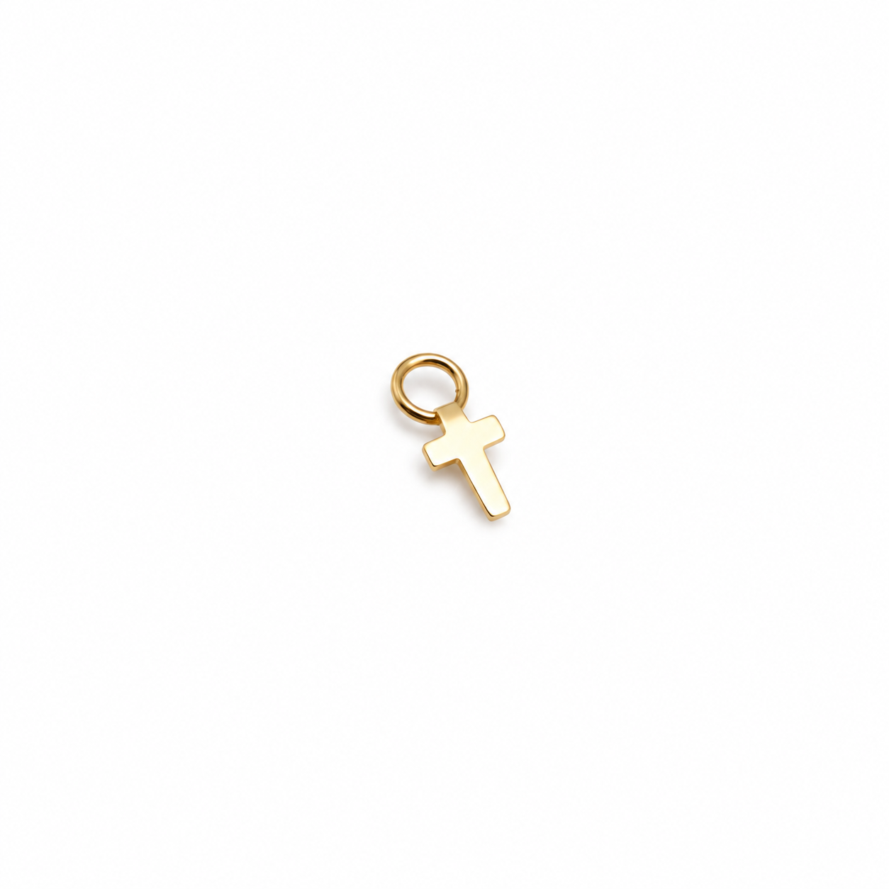 14K solid yellow gold plain cross charm with round jump ring on a white background