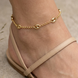14K solid yellow gold rolo chain anklet featuring polished mariner links and a fancy lobster clasp