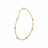 14K solid yellow gold rolo chain anklet featuring polished mariner links and a fancy lobster clasp on a white background.