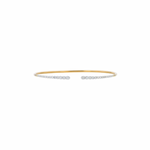 Gold and silver bangle on a white background