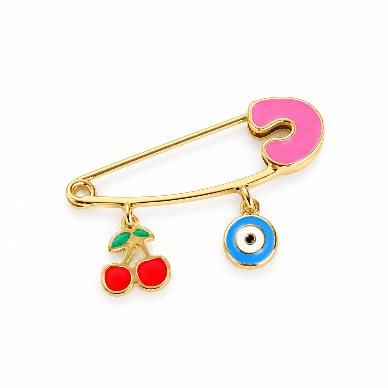 Gold-tone safety pin brooch with pink enamel, red cherry charm, and blue evil eye charm on a white background.