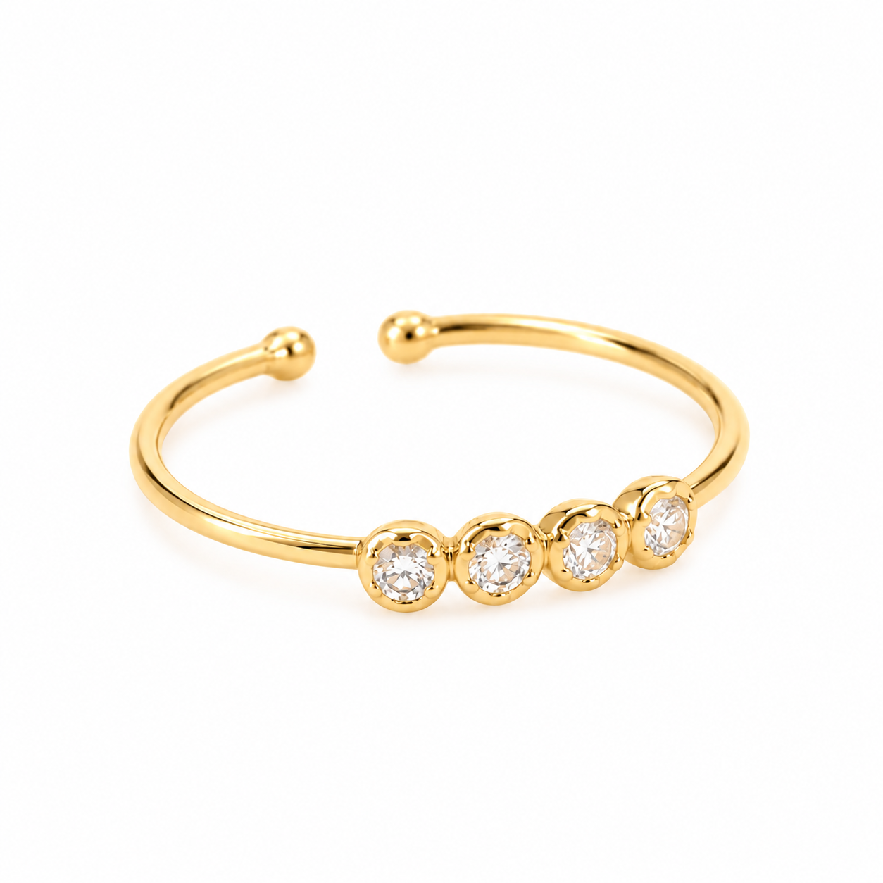14K solid yellow gold adjustable gold toe ring with four round clear cubic zirconia stones on a white background.