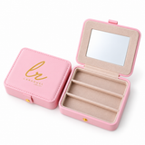 Pink Laraquel jewelry box with mirror and ring slots, open on a white background.