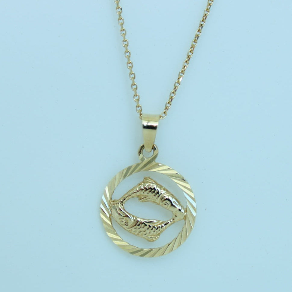 14K solid yellow gold zodiac sign pendant with diamond-cut round border, approximately 0.58 grams.