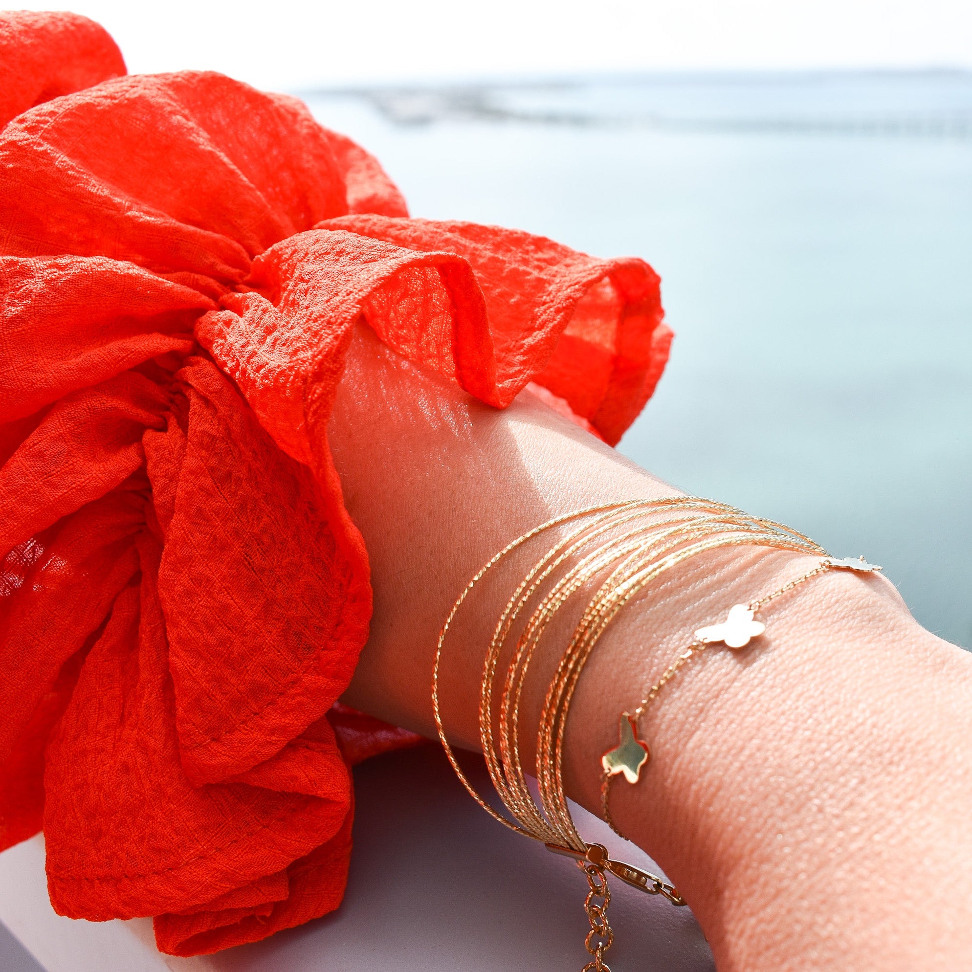 14K solid yellow gold multi-strand flexible diamond-cut bracelet with lobster clasp and adjustable extender chain.